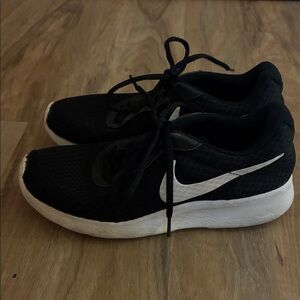 Nike Black Mesh Sneakers with White Swoosh